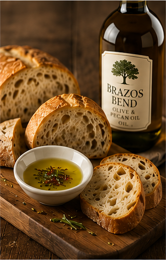 Rustic sourdough bread with a small bowl of Brazos Bend oil and herbs for dipping